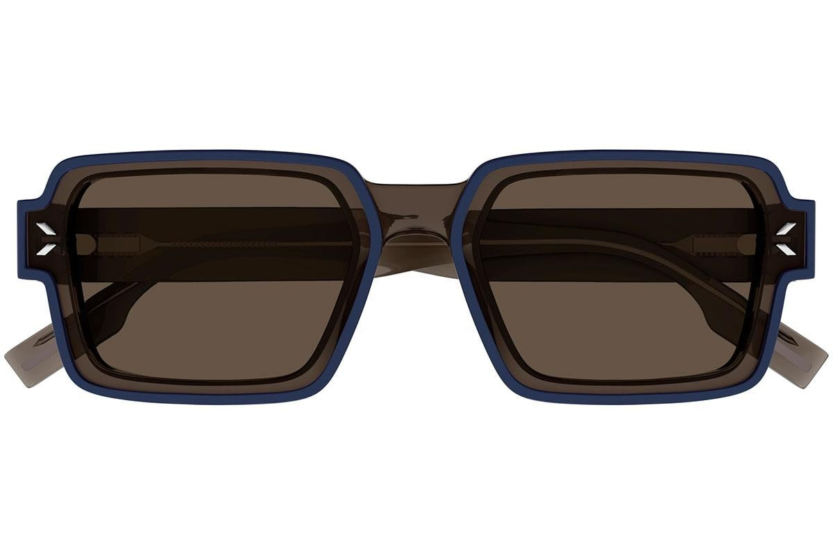 Alexander McQueen MQ0381S Rectangle Sunglasses in Solid Dark Grey Brown Lenses With Pearled Dark Blue Transparent Taupe Frame, angle view