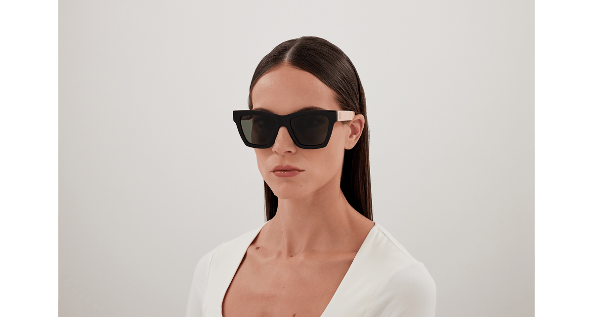 Gucci GG1714S Cat Eye Sunglasses in Grey / Black, angle view