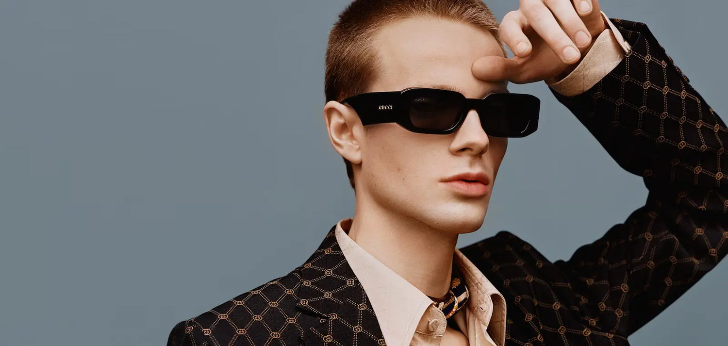 Gucci Eyewear, cut sharp and worn low.